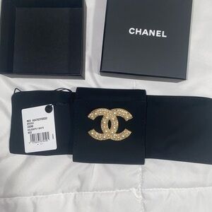 CHANEL Black Brooch with Gold Logo Accent